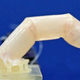 A bending robotic finger covered with human skin developed by researchers at the University of Tokyo.